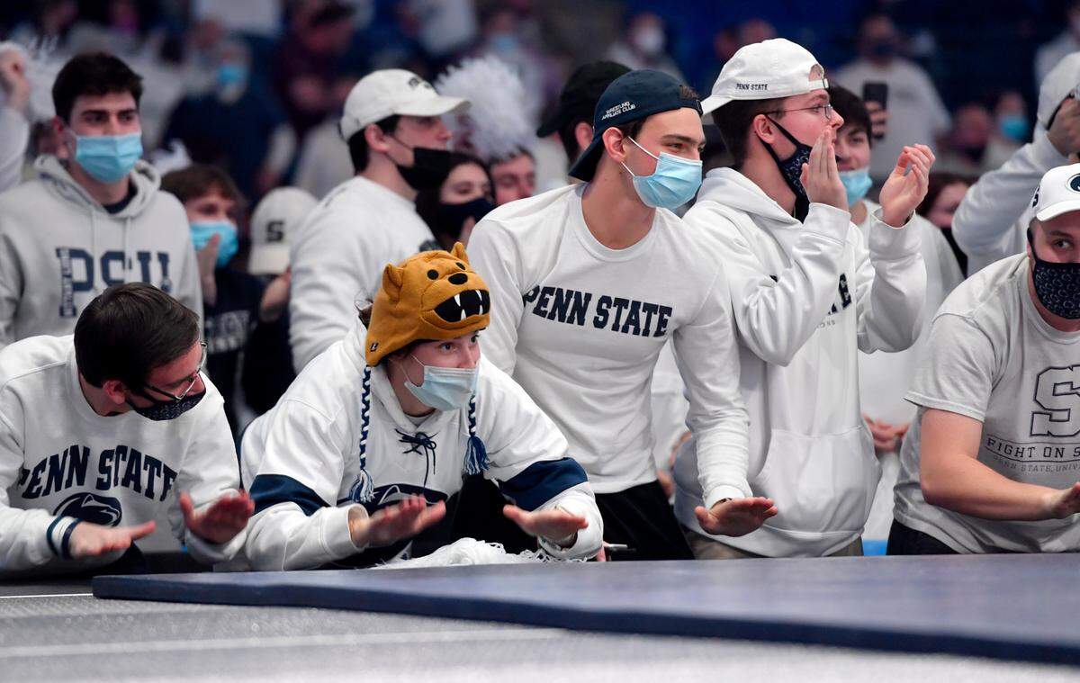 Penn State students cheer as the wrestling team beats Ohio State 32-7 on Friday, Feb. 4, 2022.