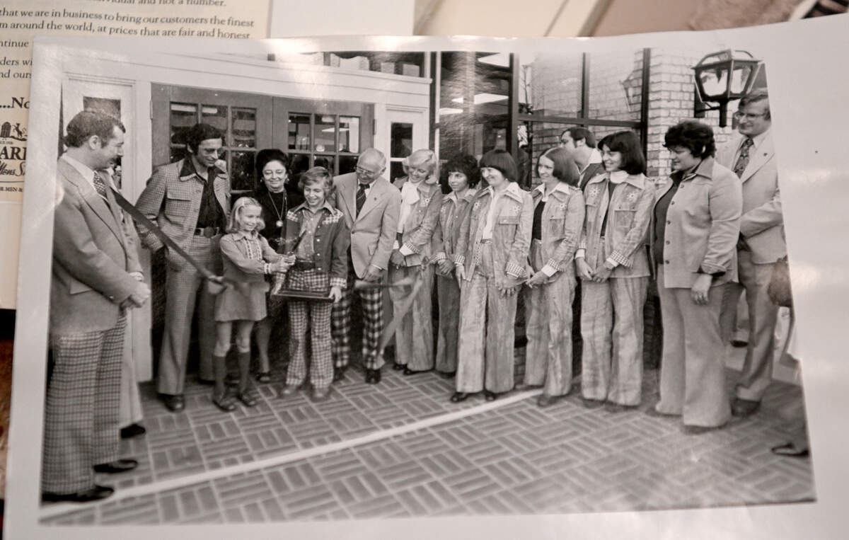 Standing in the center with his family is a young Brian Cohen during the ribbon cutting for the Young Mens Shop in Altoona. Cohen now runs Harpers in downtown State College.