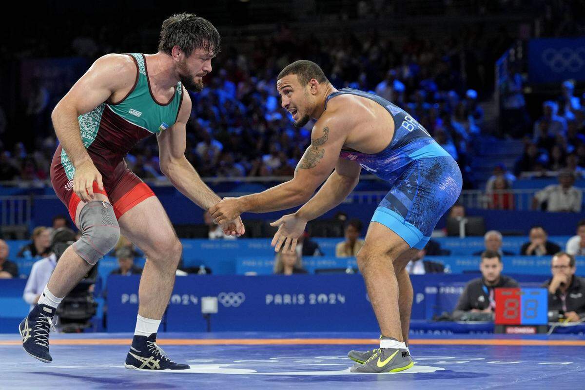 Aug 9, 2024; Paris, France; Rei Aaron Marquel Brooks (USA) defeats Javrail Shapiev (UZB) in a men's freestyle 86kg bronze medal match during the Paris 2024 Olympic Summer Games at Champ-de-Mars Arena. Mandatory Credit: John David Mercer-USA TODAY Sports