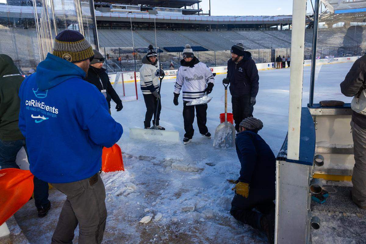 The ice maintenance crew conducts maintenance on the south eastern corner of the ice rink during the Penn State women’s hockey game at Beaver Stadium on Friday, Jan. 30, 2026, in State College, Pa. The Nittany Lions played at Beaver Stadium for the first time and defeated the Colonials 3-1.