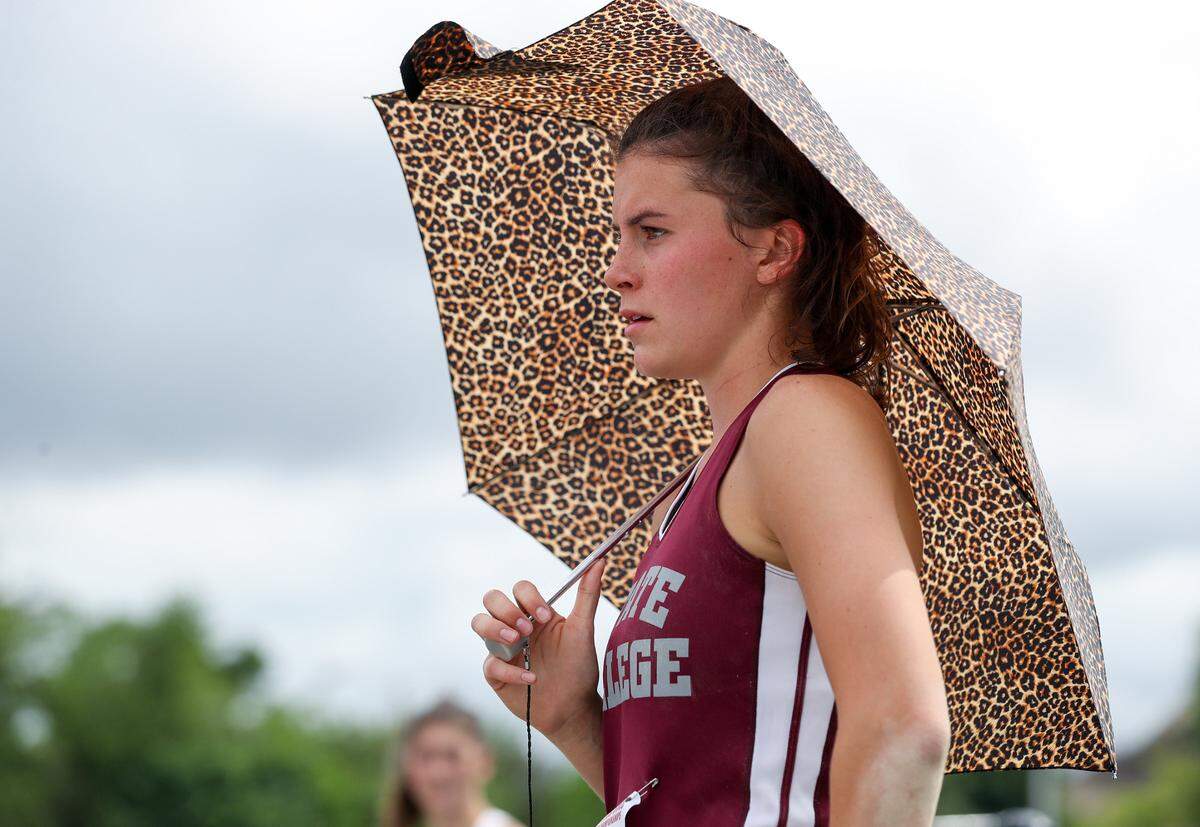 State CollegeÕs Shannon Mullin shades herself from the sun while competing in the girls Class 3A triple jump finals during the PIAA State Track and Field Championships held Friday at Seth Grove Stadium on the Shippensburg University campus in Shippensburg, PA.Matthew O’Haren/For the Centre Daily Times