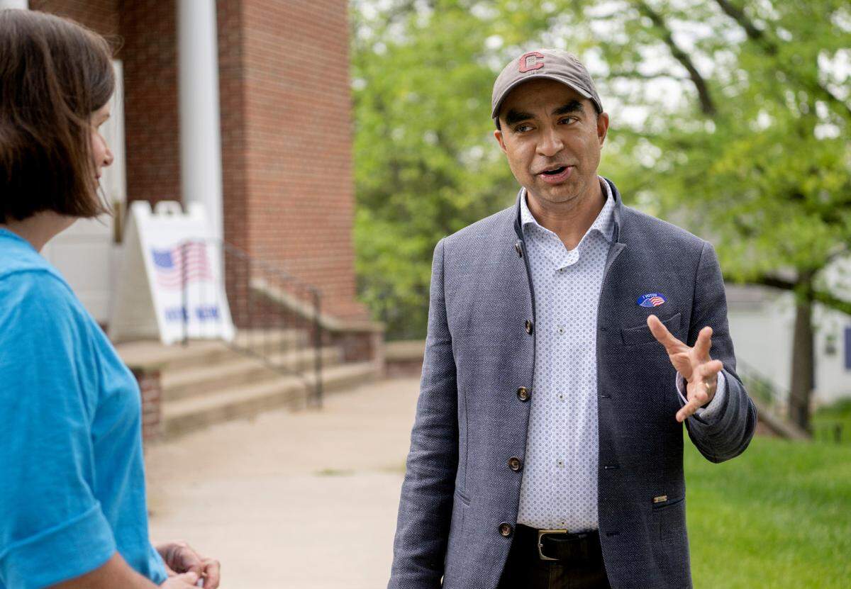 Candidate for judge Gopal Balachandran chats with people outside of the Church of Christ in State College during the primary election on Tuesday, May 16, 2023.