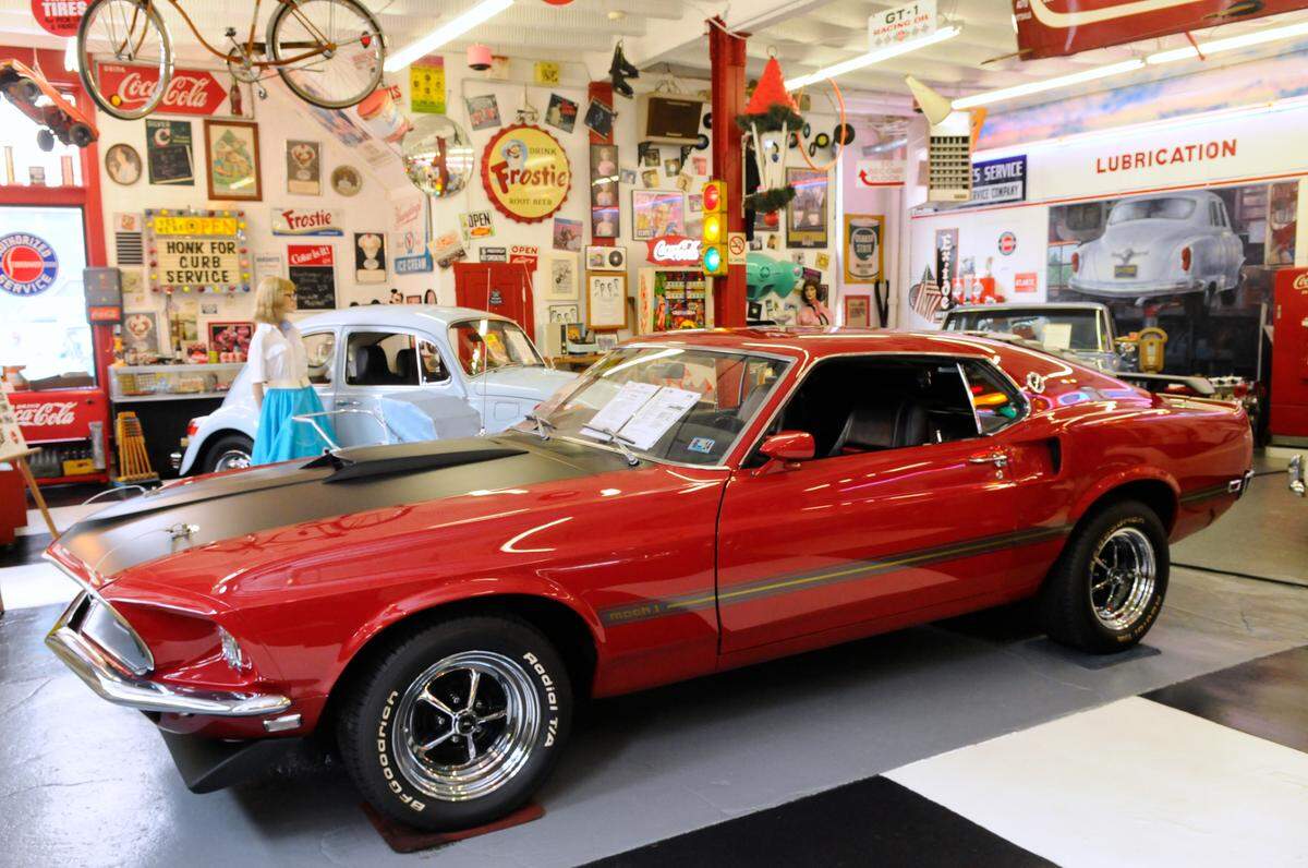 A 1969 Ford Mustang Mach 1 greets visitors at Jerry’s Classic Cars & Collectibles Museum in downtown Pottsville Thursday, April 30, 2015.