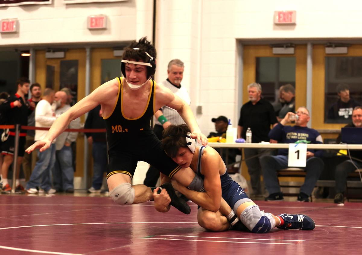 Penns Valley’s Colten Shunk finishes off a takedown of Montour’s Anthony Orlandini in their 133-pound quarterfinals match of the PIAA Class 2A Southwest Regional Championships on Friday, March 1, 2024 in Altoona. Shunk beat Orlandini, 4-3, to earn a spot in Hershey.