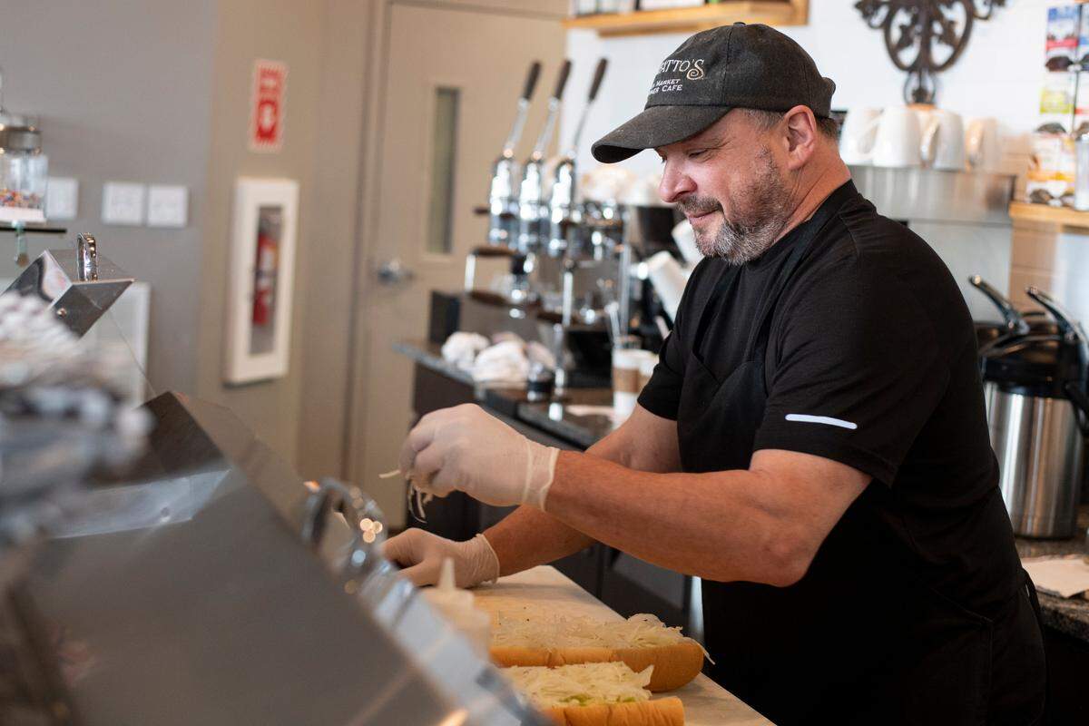 David Letterman, owner of Bonfatto’s Italian Market & Corner Café, makes a sandwich inside of his restaurant on Monday, Feb. 7, 2022 in Bellefonte, Pa.