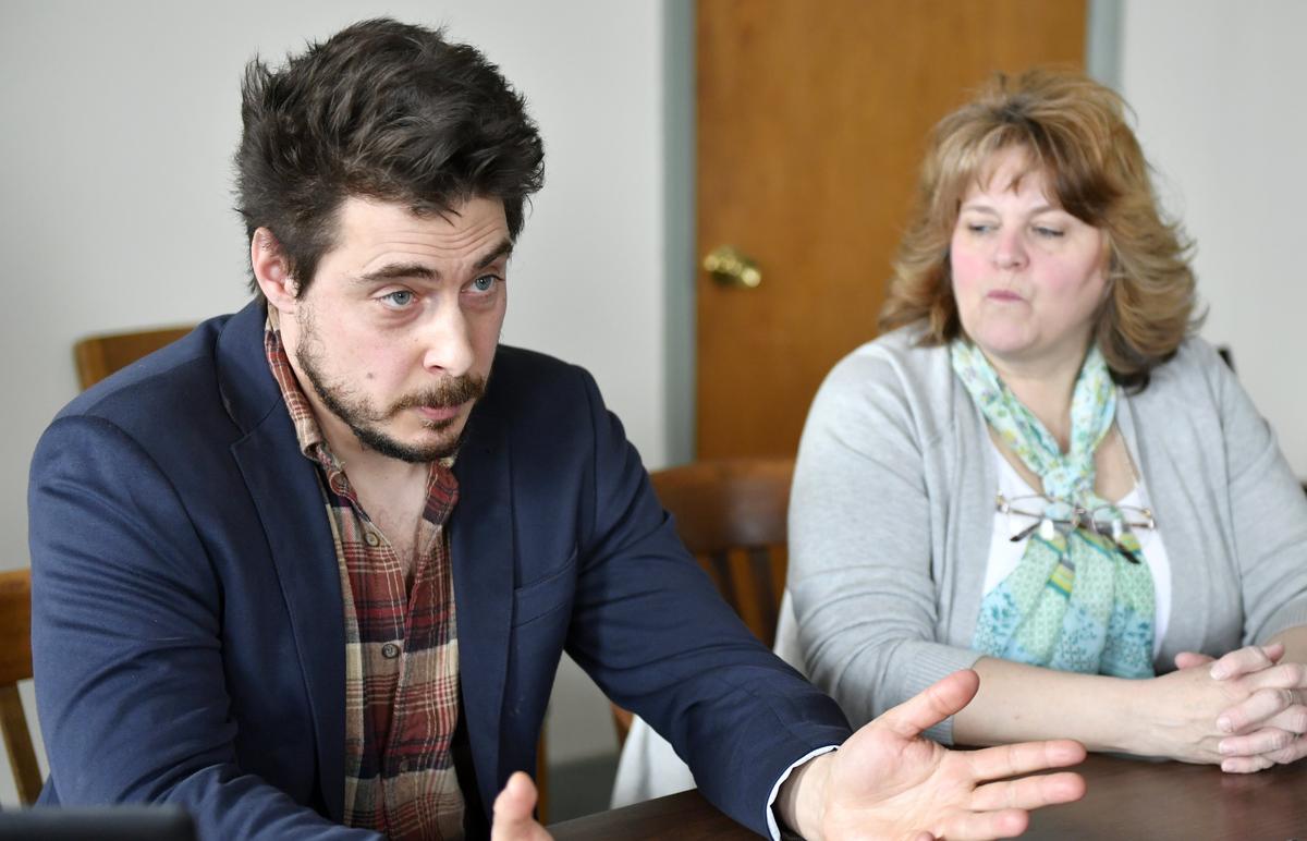 Eric Kelmenson of the Philipsburg Revitalization Corporation talks about the community and energy the organization hopes to bring together, while PRC volunteer Faith Maguire looks on, on Thursday, March 14, 2019.