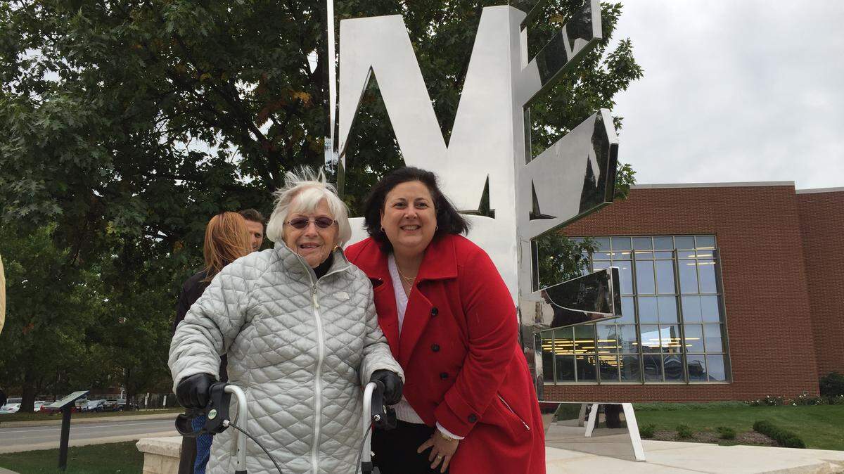 Barbara Palmer, left, and Lori Verderame attend the unveiling of the “We Are” sculpture in 2015 on the Penn State campus.