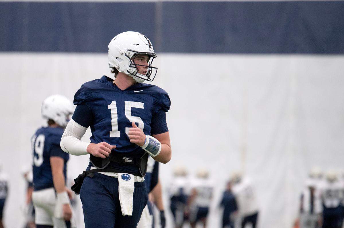 Quarterback Drew Allar runs a play action drill during football practice at Holuba Hall on Tuesday, Oct. 15, 2024.