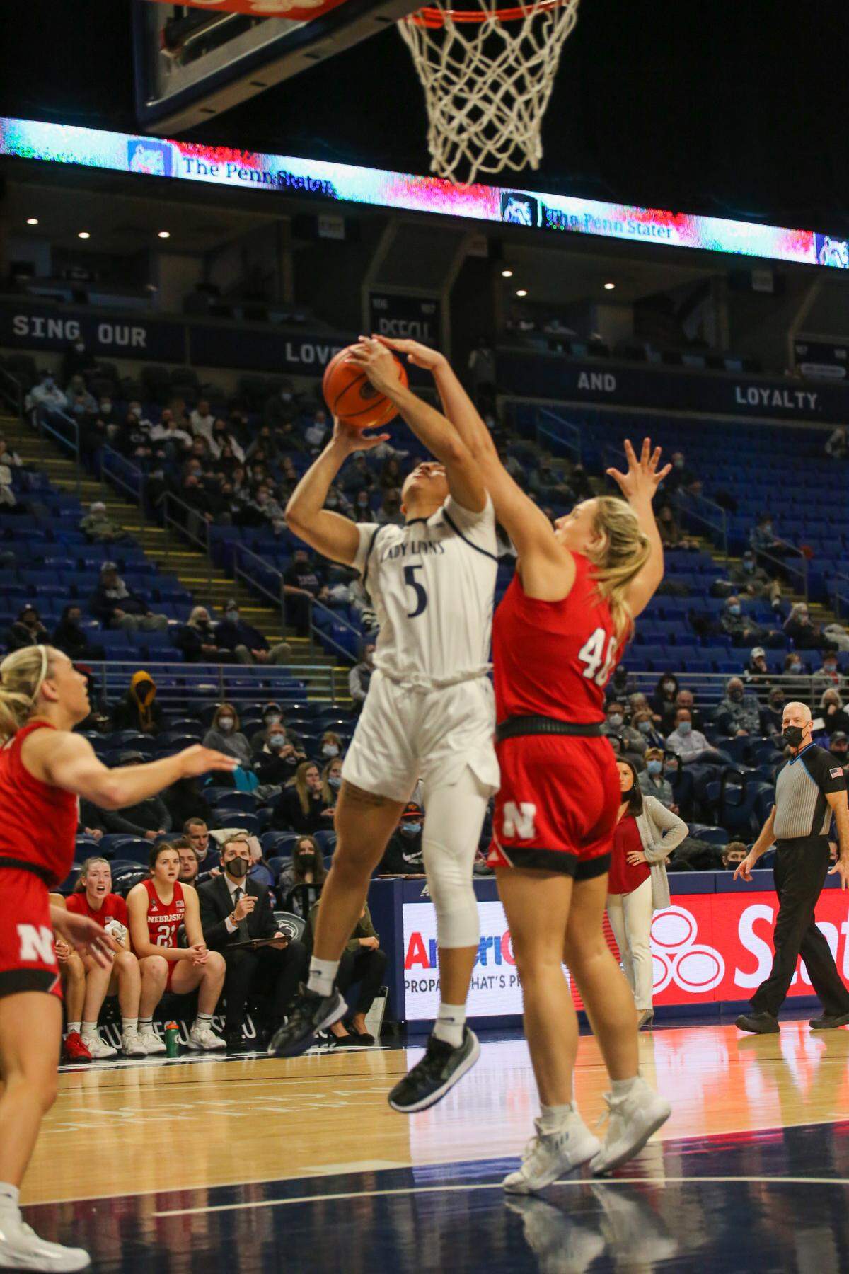 Lady Lions Leilani Kapinus goes in for a basket around a Nebraska defedner during the game on Feb. 17, 2022.