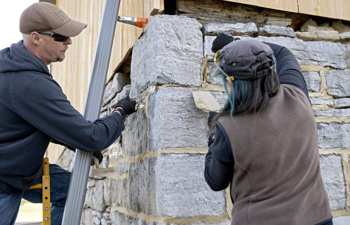 Nathan and Maria Day of Sterling Stoneworks & Restoration repoint the foundation of the barn on Gene and Rebecca Lengerich’s property on Wednesday, April 22, 2026.  