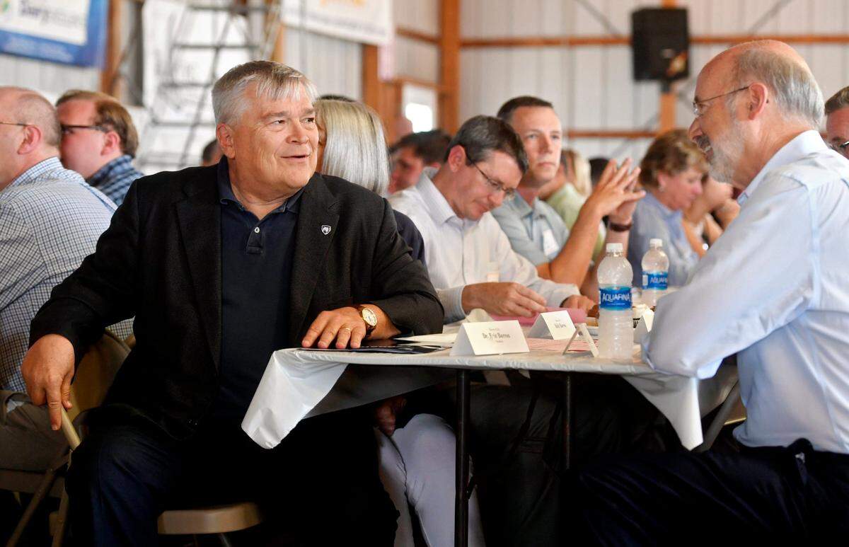 Penn State president Eric Barron and Pennsylvania Governor Tom Wolf chat at the Penn State Ag Progress Days Government and Industry Day Luncheon on Wednesday, August 16, 2017.