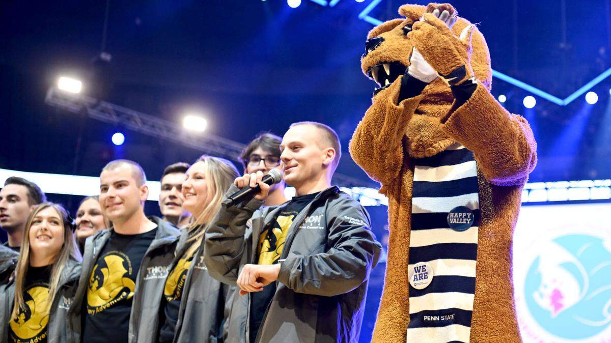The executive committee for the 2024 Penn State IFC/Panhellenic Dance Marathon and the Nittany Lion cheer on dancers as they prepare to stand for 46 hours on Friday, Feb. 16, 2024 at the Bryce Jordan Center.