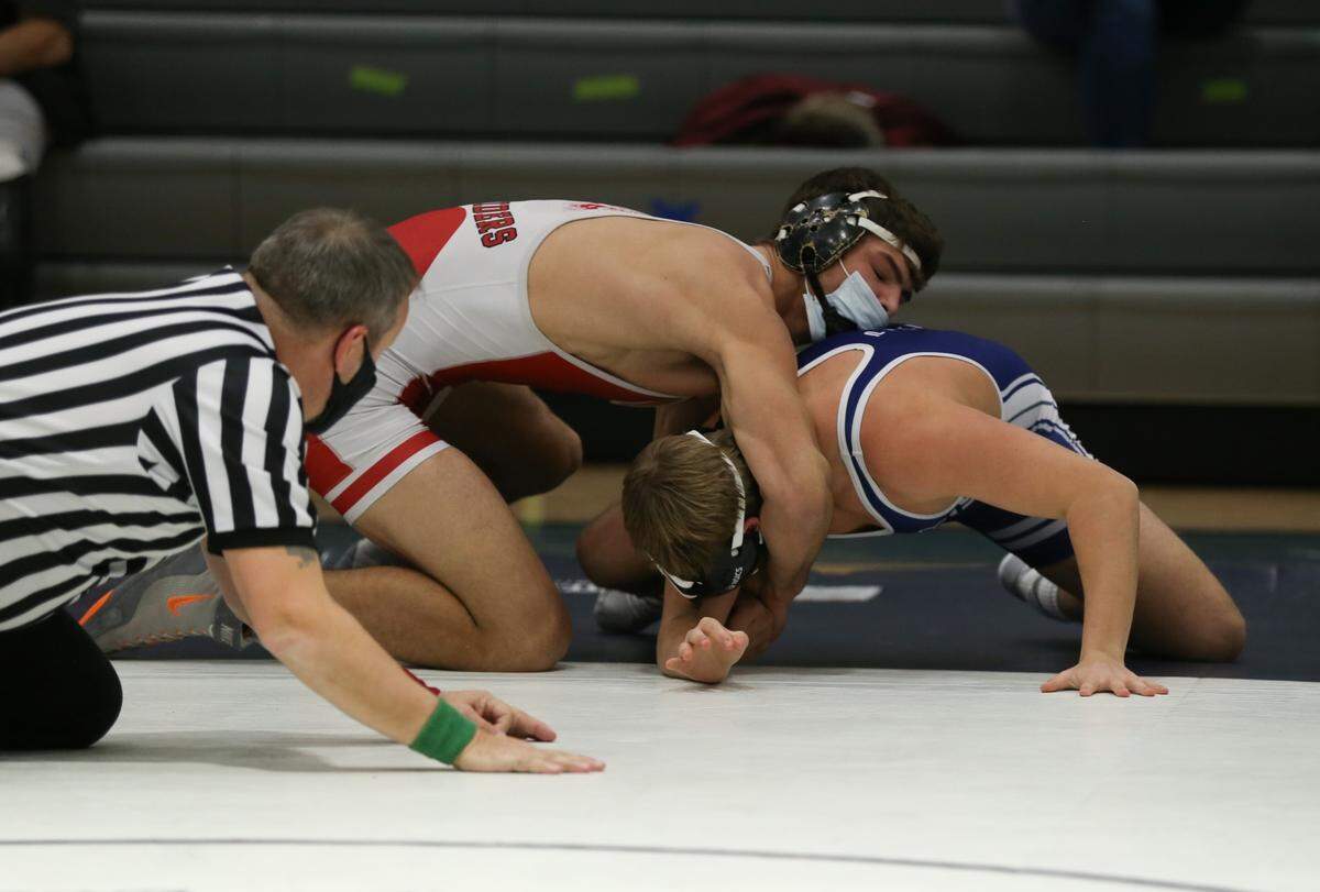 Bellefonte’s Ethan Rossman locks a cradle up on Penns Valley’s Hunter Lyons in their 189-pound match on Thursday. Rossman pinned Lyons in 37 seconds to lead the Red Raiders in a 43-15 win.