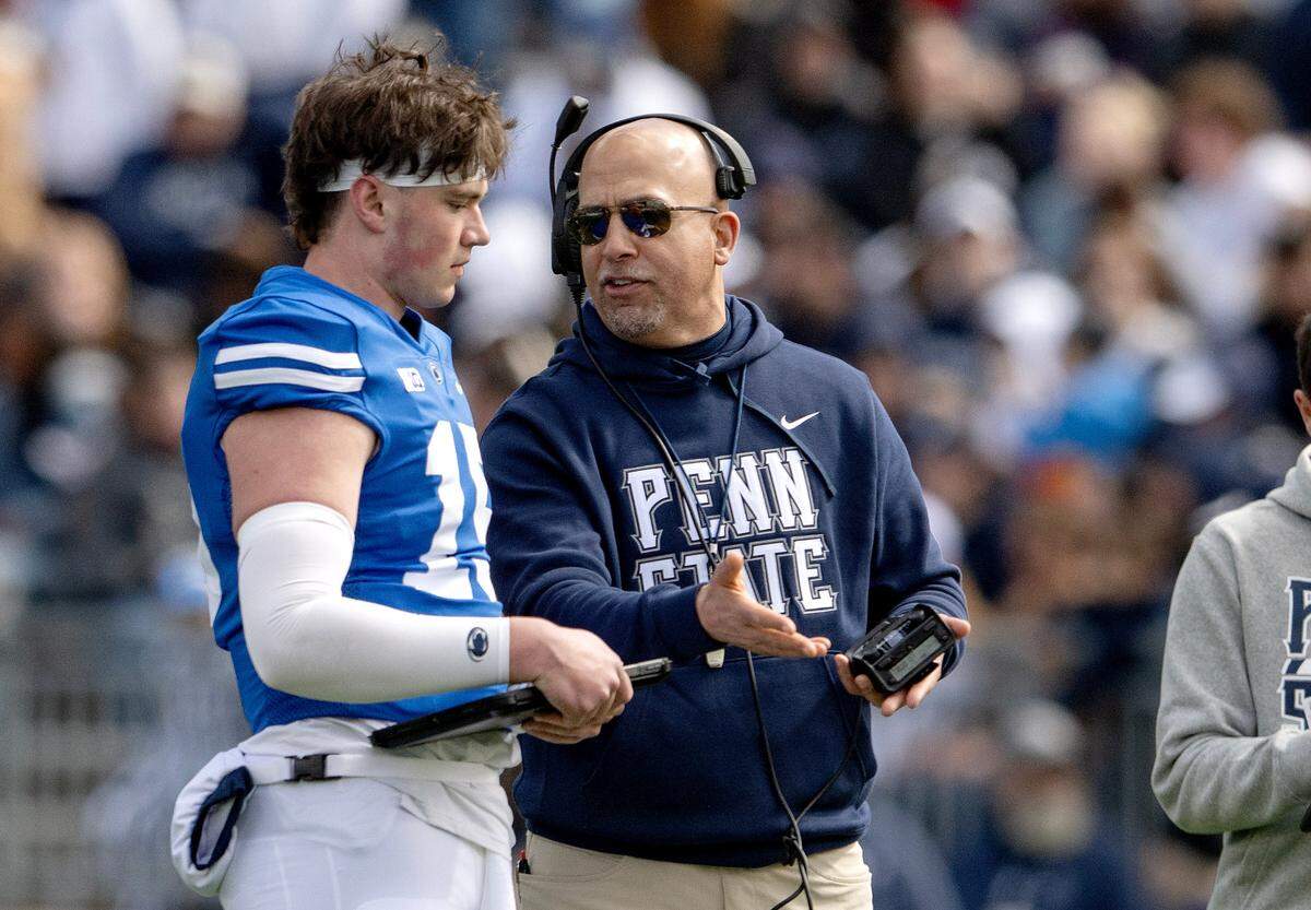 Penn State football coach James Franklin talks to quarterback Drew Allar during the Blue-White game on Saturday, April 13, 2024.  