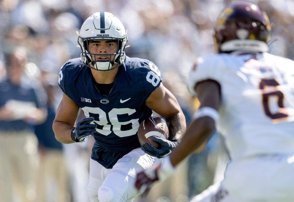 Penn State tight end Brenton Strange watches a Central Michigan defender as he runs with the ball during the game on Saturday, Sept. 24, 2022.