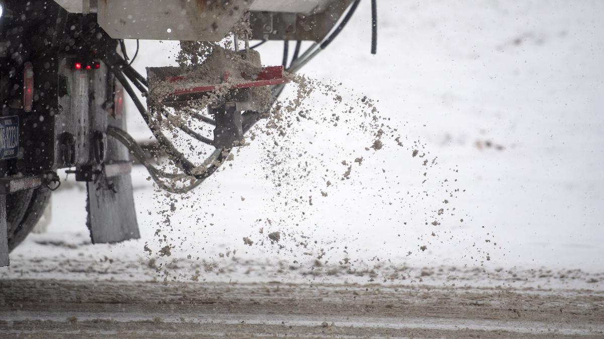 A truck spreads salt as it drives up North Atherton Street on Thursday, Nov. 15, 2018.