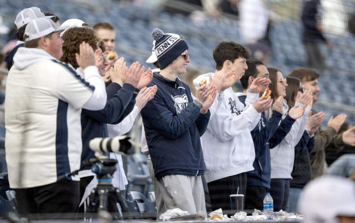 Penn State students cheer on the Nittany Lions baseball team as they take in Dollar Dog Night on Tuesday, March 24, 2026.  
