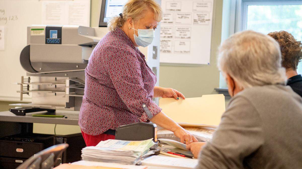 Director of elections for Centre County Beth Lechman goes over a stack of ballots as the votes are recounted for Pennsylvania’s May primary election on June 1, 2022. Lechman will step down next month.
