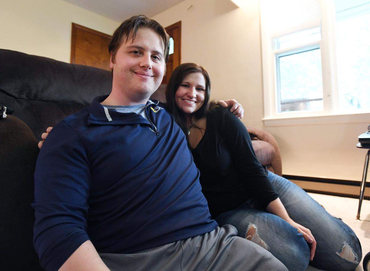 Veteran Adam Hartswick poses with his girlfriend, Sara Bordack, on May 13 at his home in College Township.