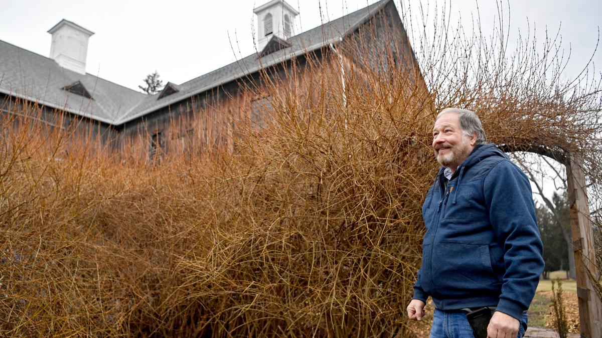 Columbus Chapel and Boal Mansion museum director Bob Cameron shows the Shakespeare secret garden outside of the Boal Barn Playhouse on Feb. 18, 2020.
