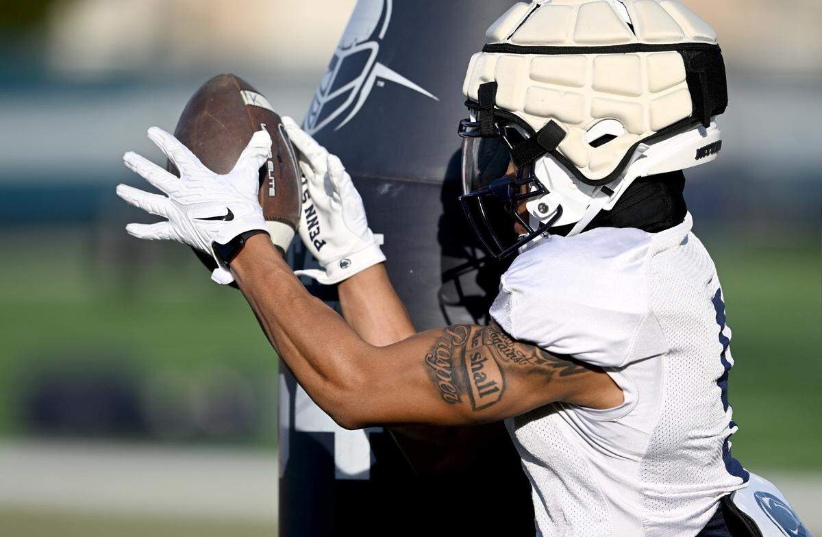 Penn State wide receiver Omari Evans makes a catch as he runs through a drill during a spring practice on Tuesday, March 21, 2023.