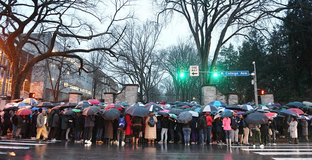 Dozens gathered at the Allen Street gates in downtown State College on Thursday, March 21, 2019, for a candlelight vigil for Osaze Osagie, 29, who was killed in a police-involved shooting.