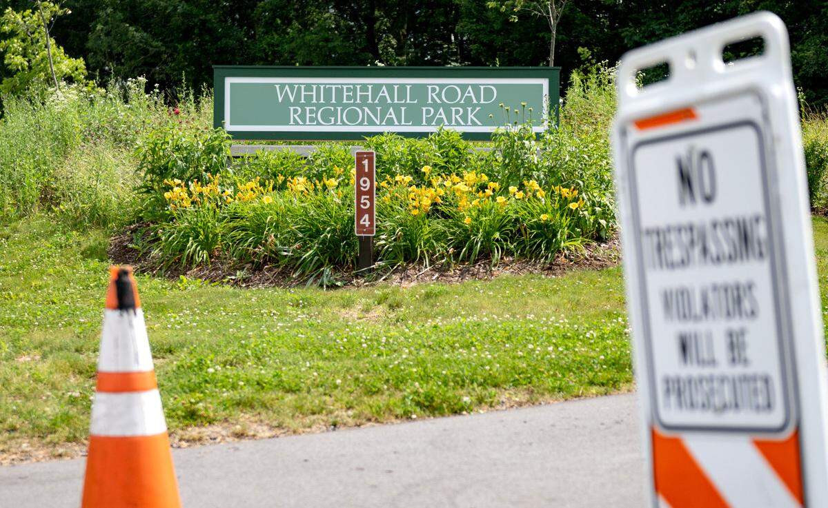 Traffic cones and a no trespassing sign at the entrance to Whitehall Road Regional Park on Wednesday, June 25, 2025.