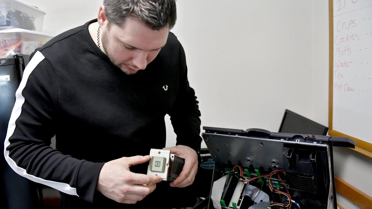 Roman Nekrasov works with a computer processor and heat sink at South Hills School of Business and Technology in State College on April 9.