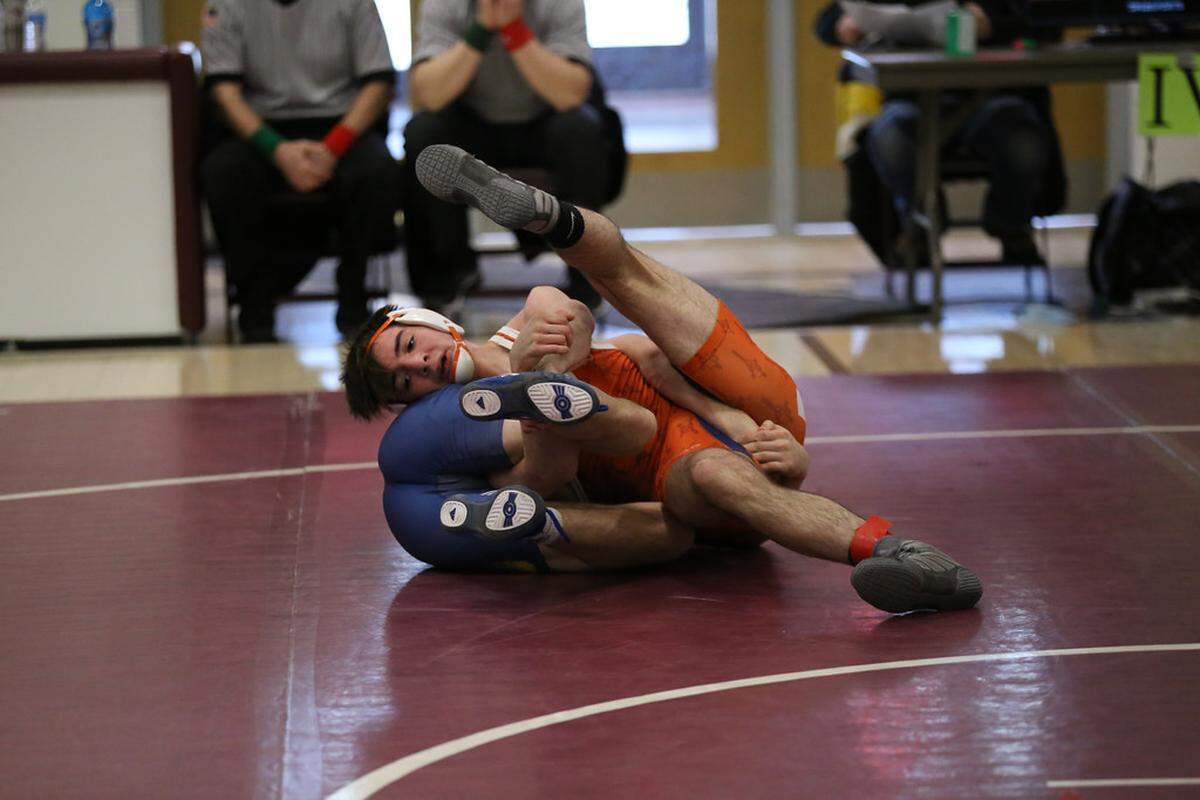 St. Joseph’s Catholic Academy’s Amonn Ohl scrambles with Glendale’s Brock McMillen in their 138 lb championship match of the District 6 Class 2A Championships on Saturday in Altoona.