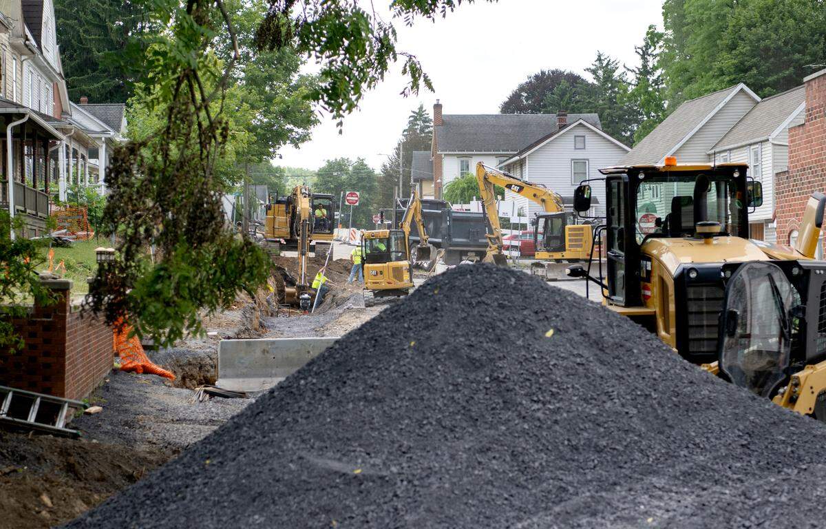 Pike Street in Lemont is one way as work continues on stormwater upgrades, sidewalks and more on Thursday, July 21, 2022.
