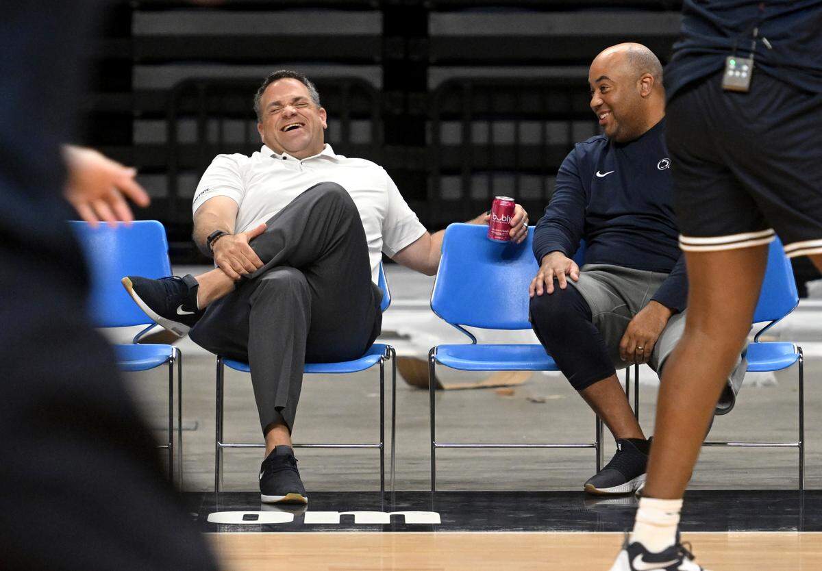 Penn State athletic director Pat Kraft and Penn State men’s basketball coach Micah Shrewsberry talk as the hoops team warms up for a summer practice on Tuesday, July 19, 2022.