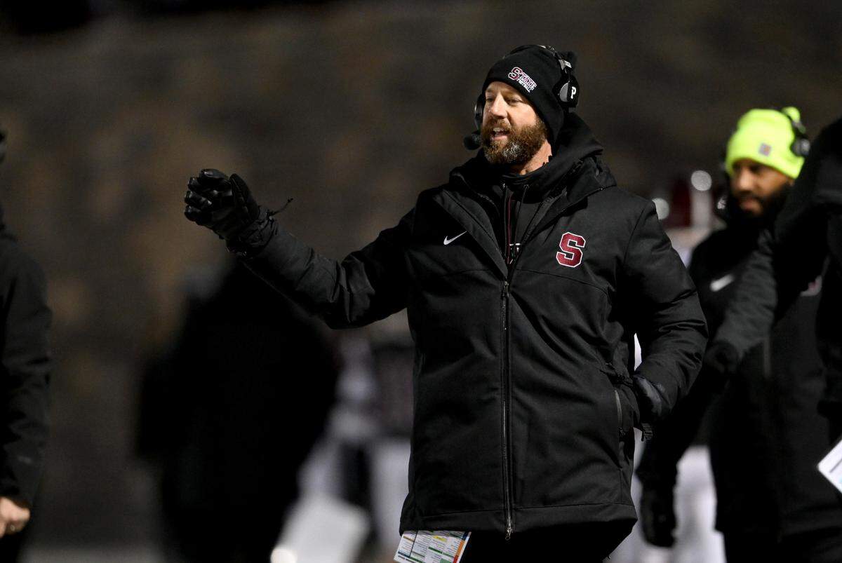 State College football coach Matt Lintal motions to his players during the game against McDowell on Friday, Nov. 18, 2022.