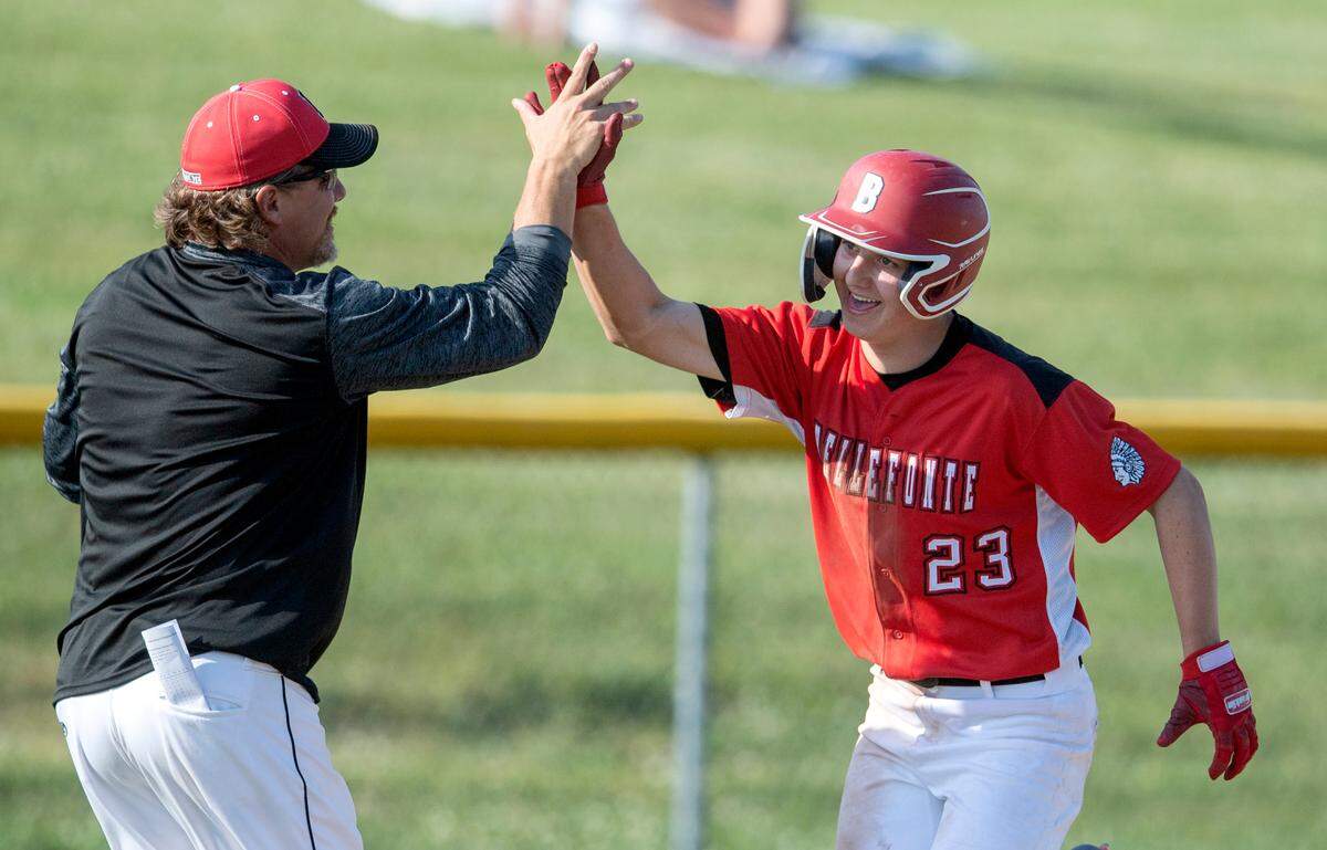 Bellefonte baseball coach Jon Clark high fives Trevor Johnson as he round third from his out of the park homer to win the District 6 4A championship game against Juanita 14-2 in the fifth inning on Tuesday, May 31, 2022.