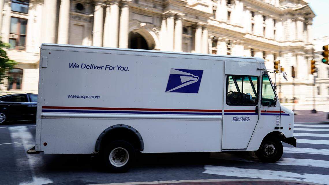 File photo of a U.S. Postal Service truck in Philadelphia. A Philadelphia man was recently sentenced to federal prison after authorities said he terrorized mail carriers while robbing them of packages with a fake gun.