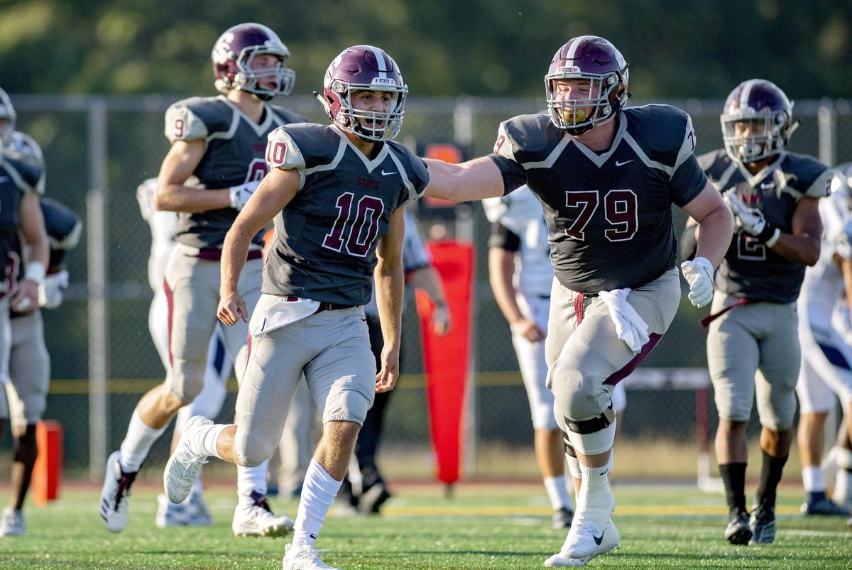 State College’s Brady Dorner celebrates his touchdown in the first quarter of the game against St. Augustine on Friday, August 30, 2019 at the South Track Field.