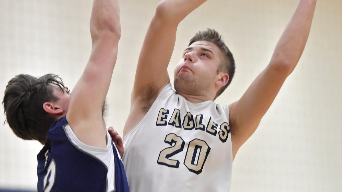 Bald Eagle Area’s Drew Bucha goes up for a basket around a Philipsburg-Osceola defender during the game on Tuesday, Jan. 29, 2019.