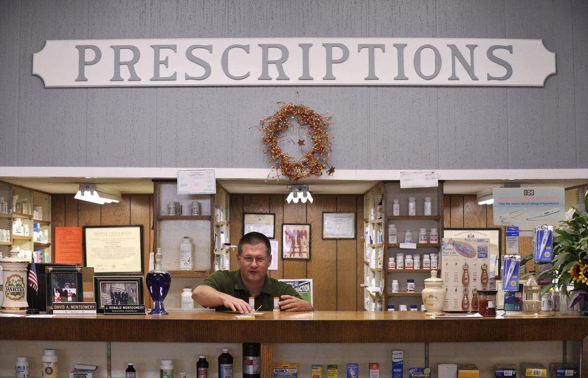Pharmacist David A. Montgomery fills a prescription at Parrish Apothecary Shop in 2010.