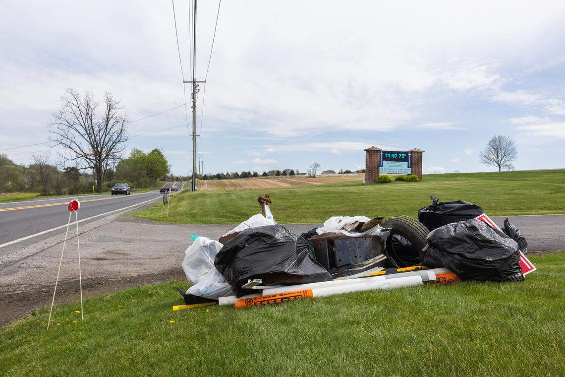 Trash bags are piled along Route 550 in front of Halfmoon Christian Fellowship Church in Port Matilda, Pa., on Saturday, April 18, 2026. The ClearWater Conservancy organized volunteers across Centre County to clean up public green spaces.