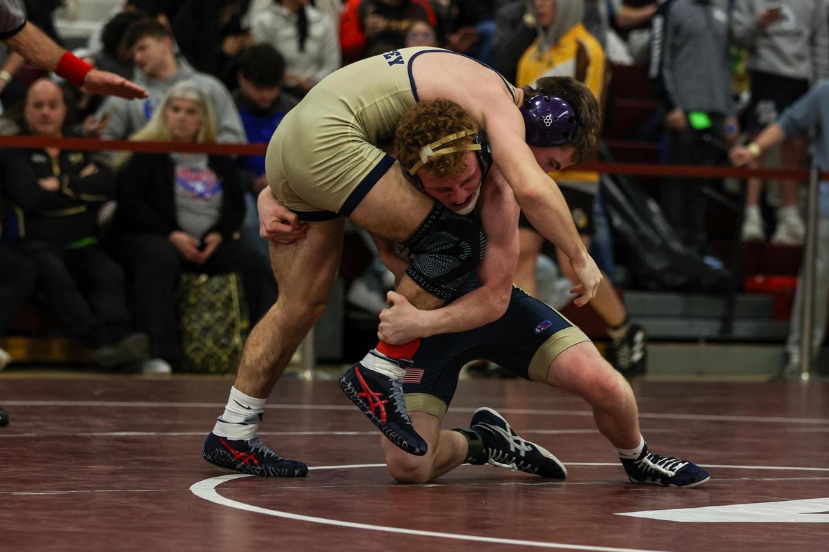 Bald Eagle Area’s Dawson Lomison looks to take down McGuffey’s Lucas Barr in their 139-pound quarterfinals match of the PIAA Class 2A Southwest Regional on Friday in Altoona. Lomison beat Barr, 9-8.