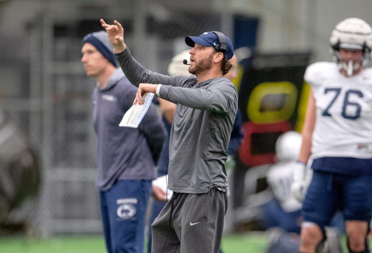 Penn State offensive coordinator Mike Yurcich motions to the players during practice on Friday, Dec. 17, 2021.