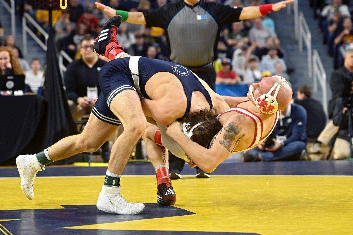 Penn State’s Levi Haines takes down Nebraska’s Peyton Robb during sudden victory of the 157 lb championship bout of the Big Ten wrestling championships at the Crisler Center on Sunday, March 5, 2023.