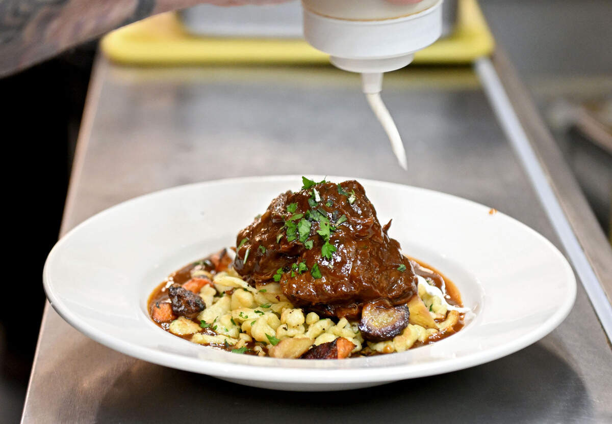 Elk Creek Cafe + Aleworks Chef Jonathan Forshey adds the horseradish cream to the Poe Paddy Porter braised beef on Friday, Jan. 24, 2025.