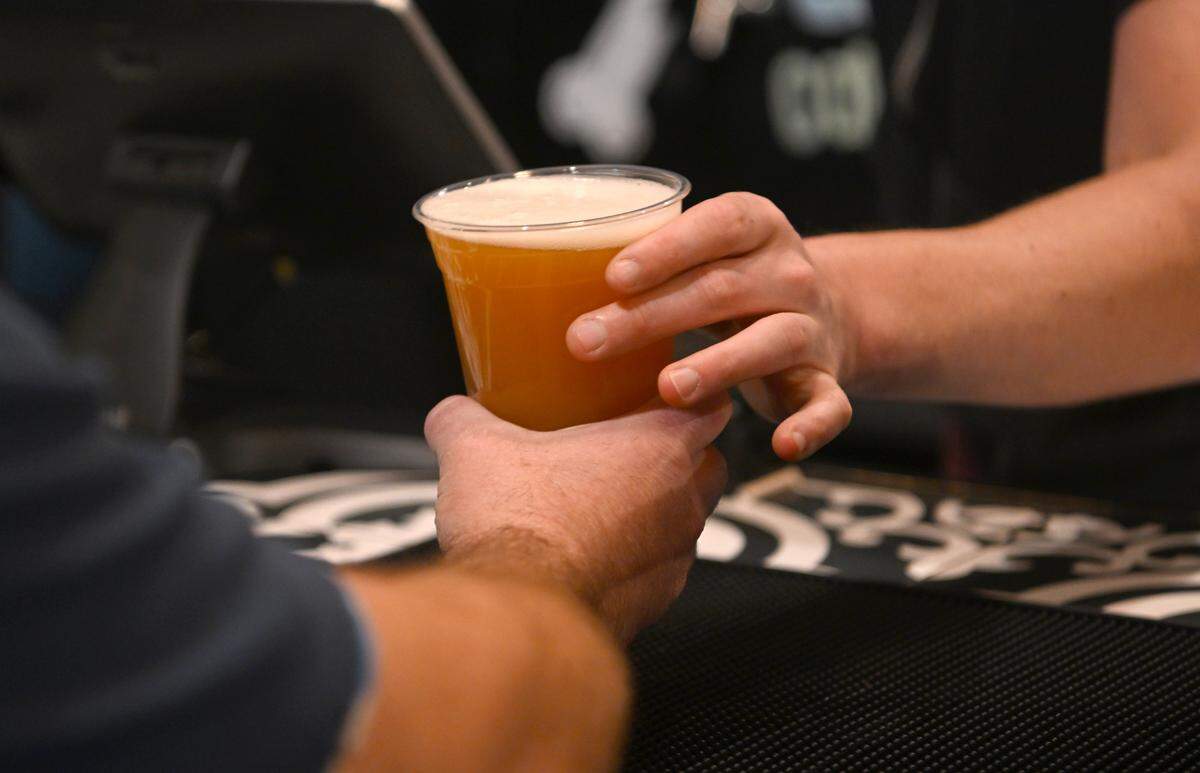 A customer gets a Fashio Killa at Voodoo Brewery in State College on Tuesday, October. 24, 2023.