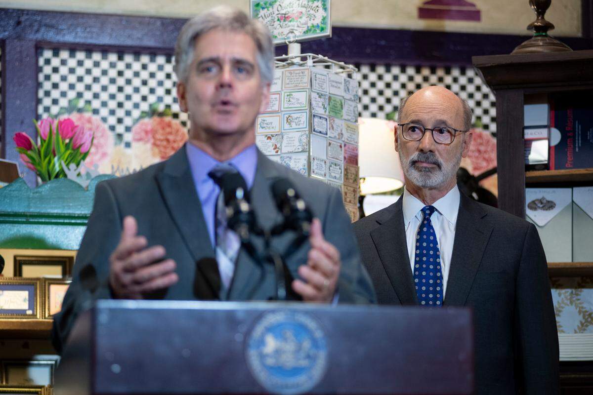 Governor Tom Wolf listens to Pennsylvania General Assembly Member Scott Conklin as he addresses a crowd during an event at the Nittany Quill on Wednesday, April 6, 2022 in State College, Pa. Governor Tom Wolf announced his plan to use American Rescue Plan funds to help local businesses.