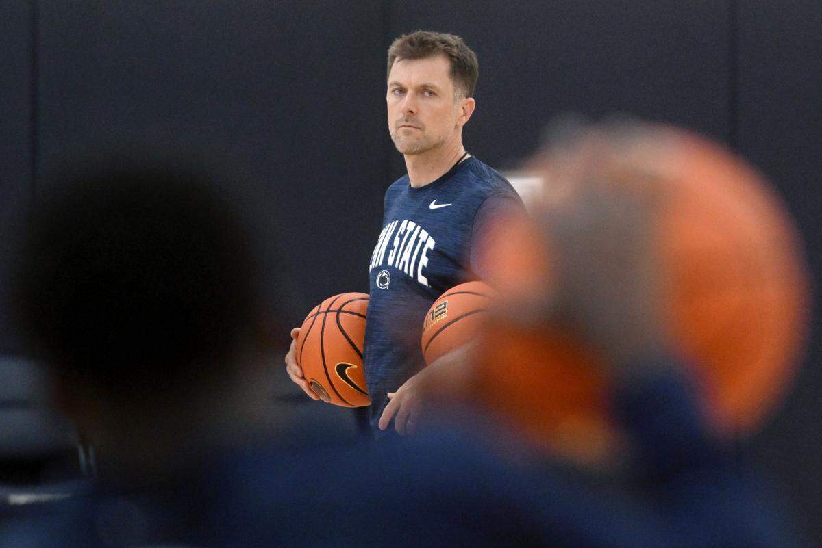 Penn State men’s basketball assistance coach Joe Crispin watches players run a drill during a summer workout on Tuesday, July 11, 2023.