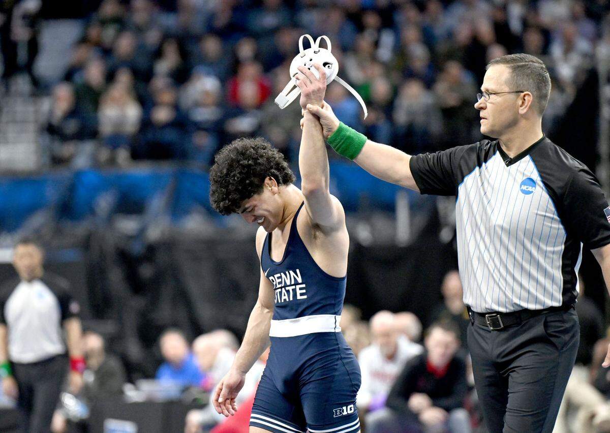 Penn State’s Beau Bartlett has his hand raised after winning third place at 141 pounds in the 2025 NCAA Wrestling Championships in Philadelphia’s Wells Fargo Center on Saturday, March 22, 2025.