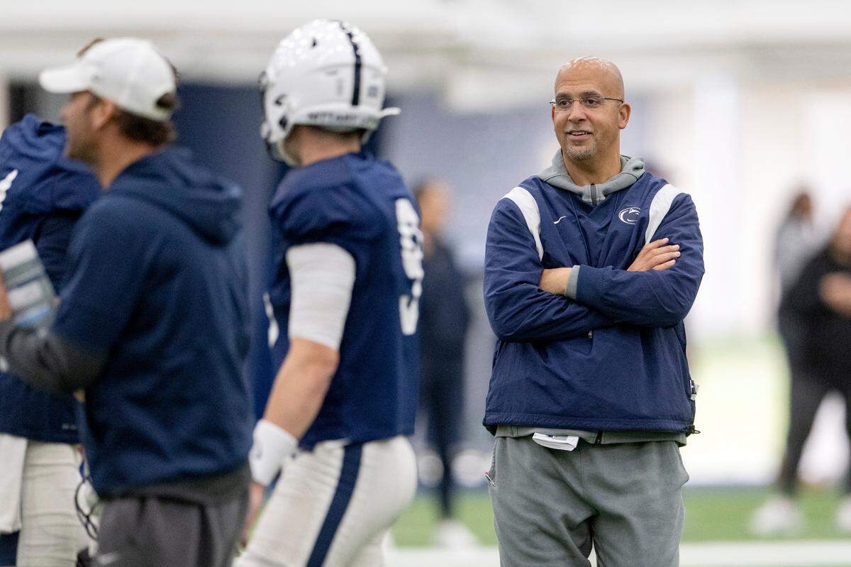 Penn State football coach James Franklin talks to the quarterbacks as they run drills during practice on Wednesday, Oct. 19, 2022.