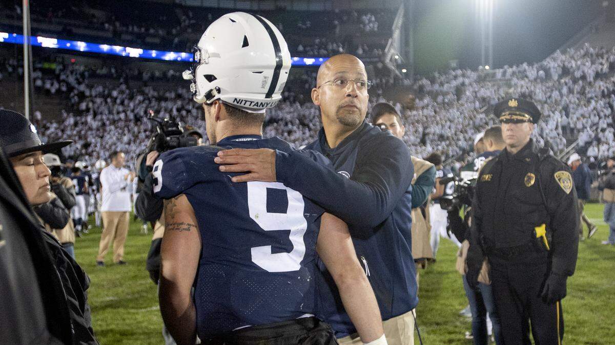 Penn State football coach James Franklin pats quarterback Trace McSorley on the back as they walk off the field following the 21-17 loss to Michigan State on Saturday, Oct. 13, 2018.