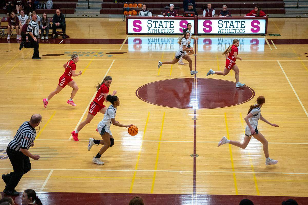 The State College girls basketball team drives down the court during a game against Williamsport at State College Area High School on Monday, Feb. 2, 2026. The Little Lions defeated the Millionaires 40-28.