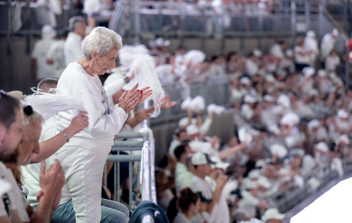 A fan claps along with the Penn State Blue Band in their pregame show on Saturday, Sept. 27, 2025.  